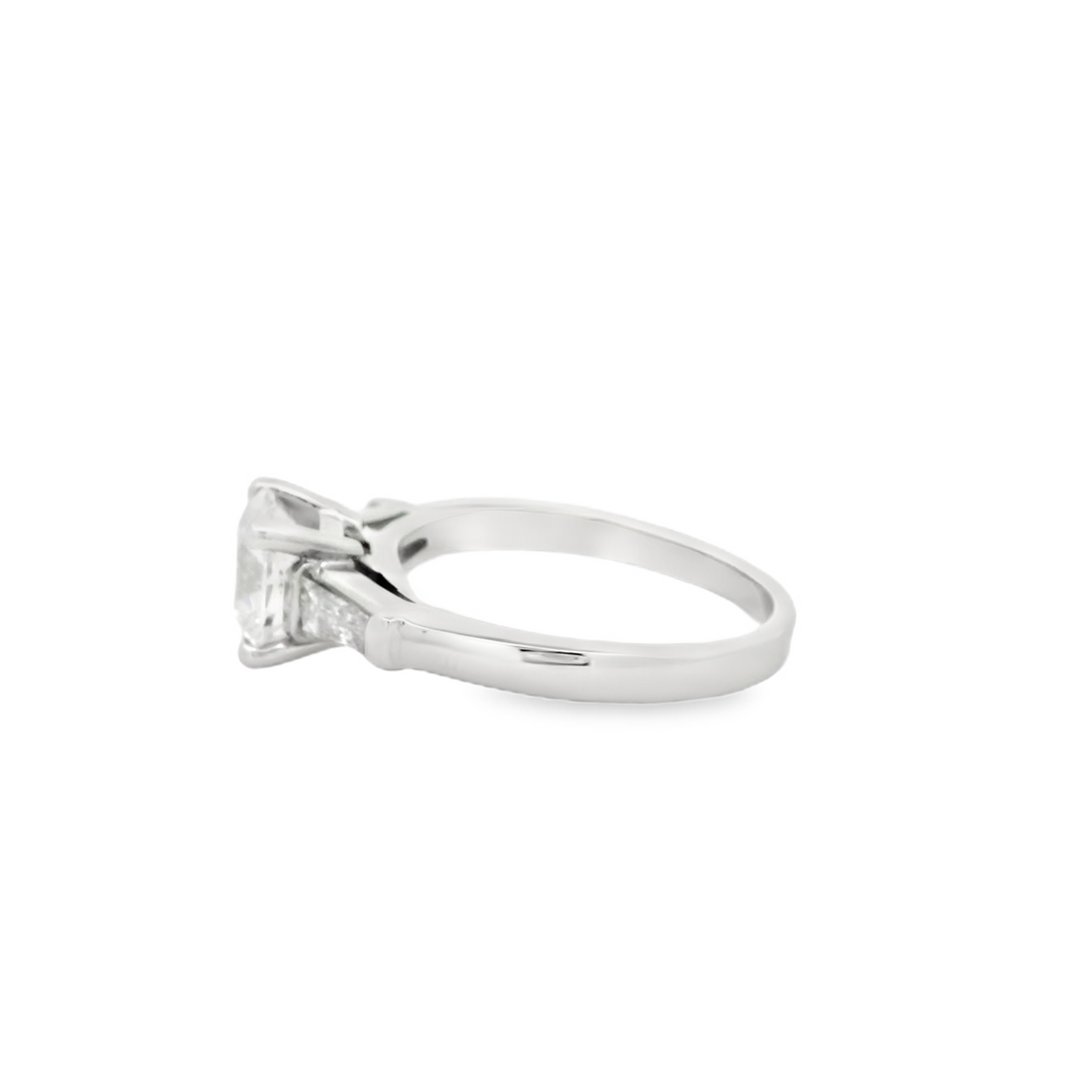 Estate Platinum Three Stone Engagement Ring set with 1 1.74 ct Round Diamond, F SI1, and 2 Baguette Diamonds, 0.46 ctw