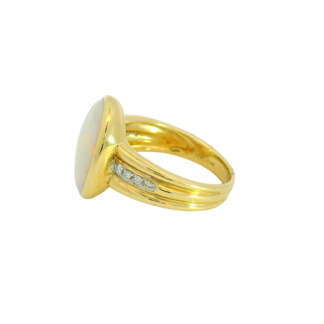 14K Yellow Gold Accented Gemstone Ring set with 1 Opal 4.40 ctw. and Diamonds 0.09 ctw.,   total stone weight measures 4.49 ctw.