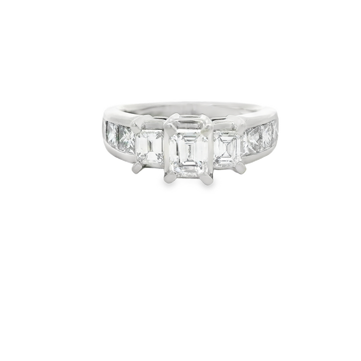 Estate 14K White Gold Three Stone Engagement Ring set with 3 1.28 ct Emerald Cut Diamonds, F/G VS1 - VS2, and 6 Princess Cut Diamonds, 0.92 ctw
