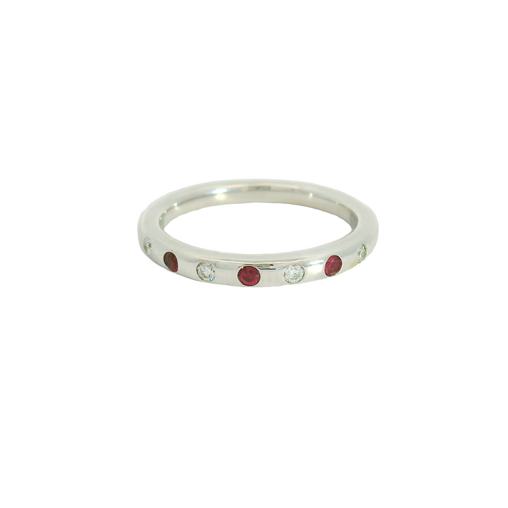 14K White Gold Band Gemstone Ring set with 3 Rubies, 0.09 ctw and 4 G/H SI Diamonds, 0.08 ctw,  total stone weight measures 0.17 ctw.