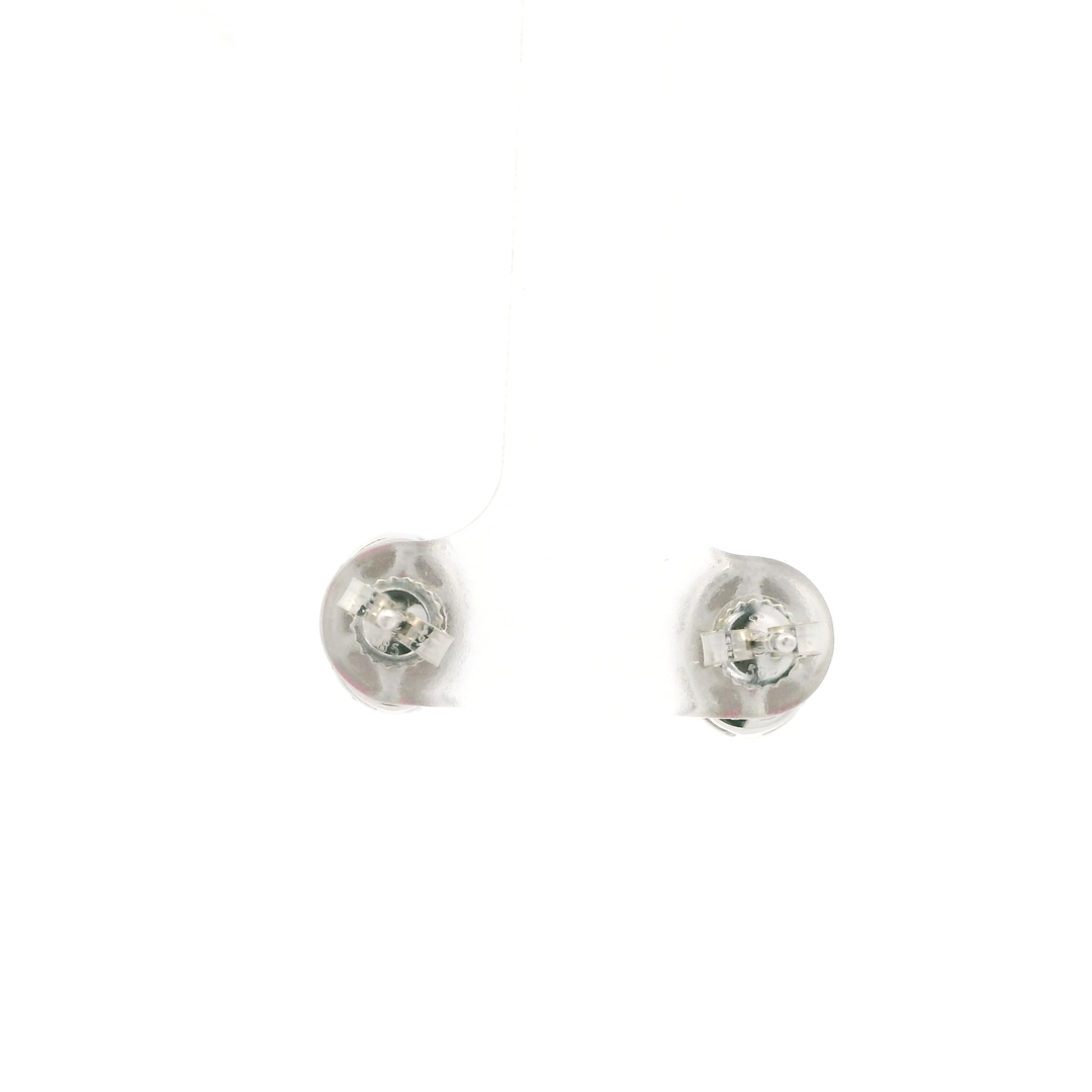 14K White Gold Stud Earrings set with 2 Oval Rubies, 1.45 ctw and 28 Round Diamonds, 0.33 ctw