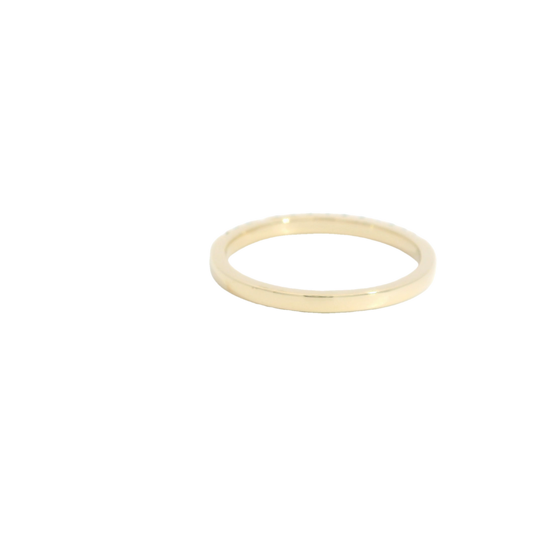 14K Yellow Gold Band Gemstone Ring set with 14 Emeralds total stone weight measures 0.22 ctw.