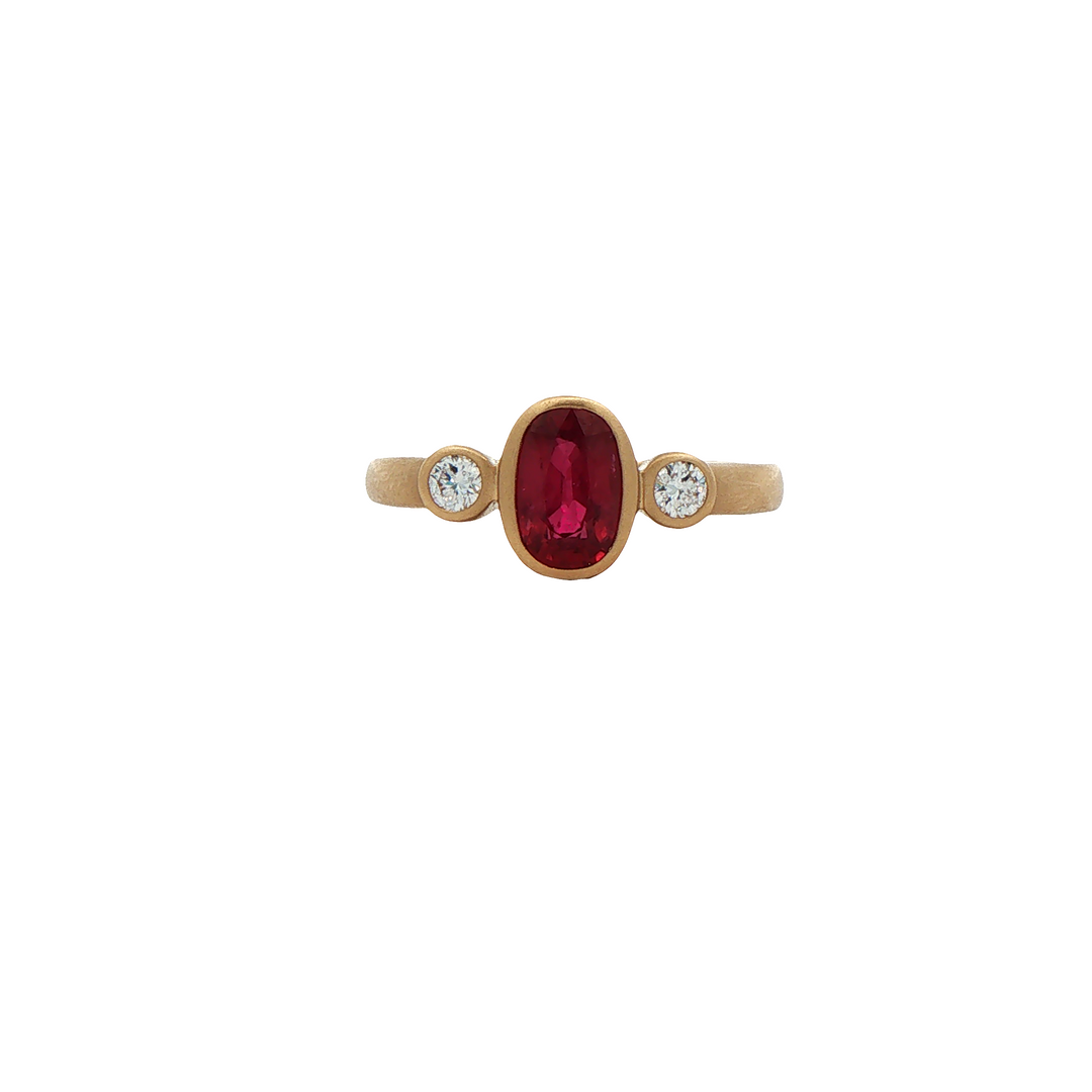 14K Yellow Gold Bezel set Ring with 1 Oval Ruby, 1.03 ct and 2 Round Diamonds, 0.12 ctw