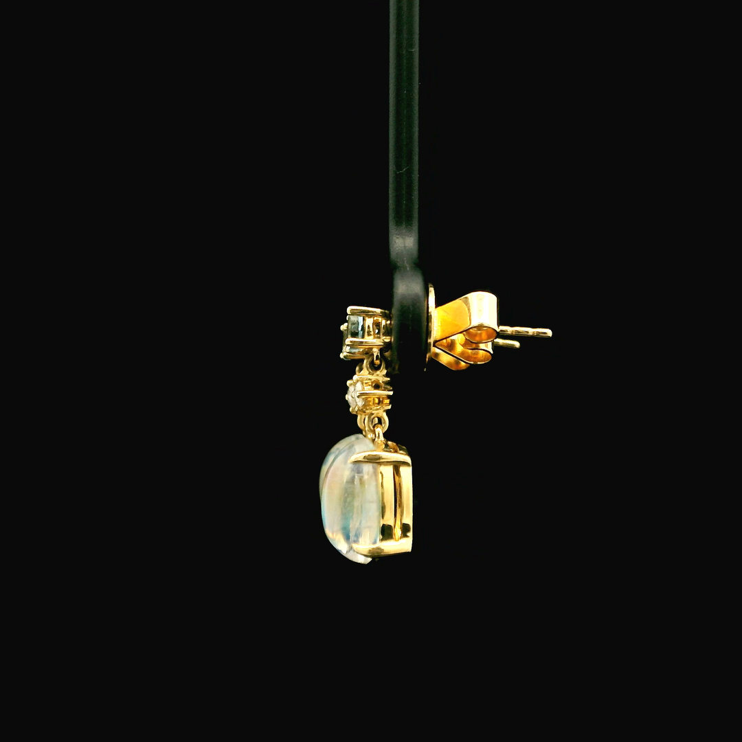 14K Yellow Gold Drop Earrings set with 2 Cabochon Moonstones, 3.53 ctw, 2 Round Diamonds, 0.06 ctw and 2 Round Aquamarines, 0.26 ctw