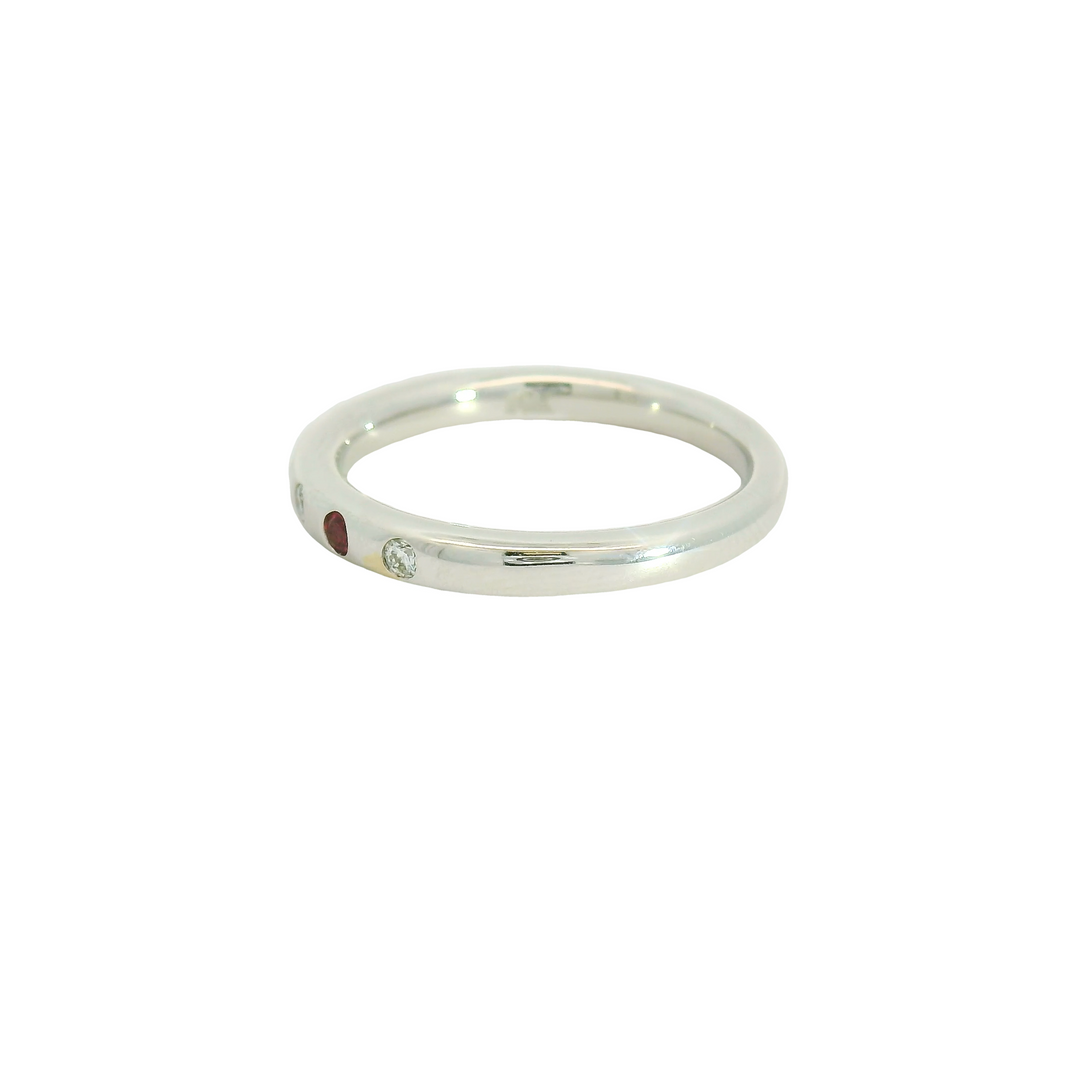 14K White Gold Band Gemstone Ring set with 3 Rubies, 0.09 ctw and 4 G/H SI Diamonds, 0.08 ctw,  total stone weight measures 0.17 ctw.