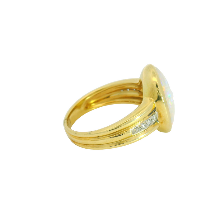 14K Yellow Gold Accented Gemstone Ring set with 1 Opal 4.40 ctw. and Diamonds 0.09 ctw.,   total stone weight measures 4.49 ctw.