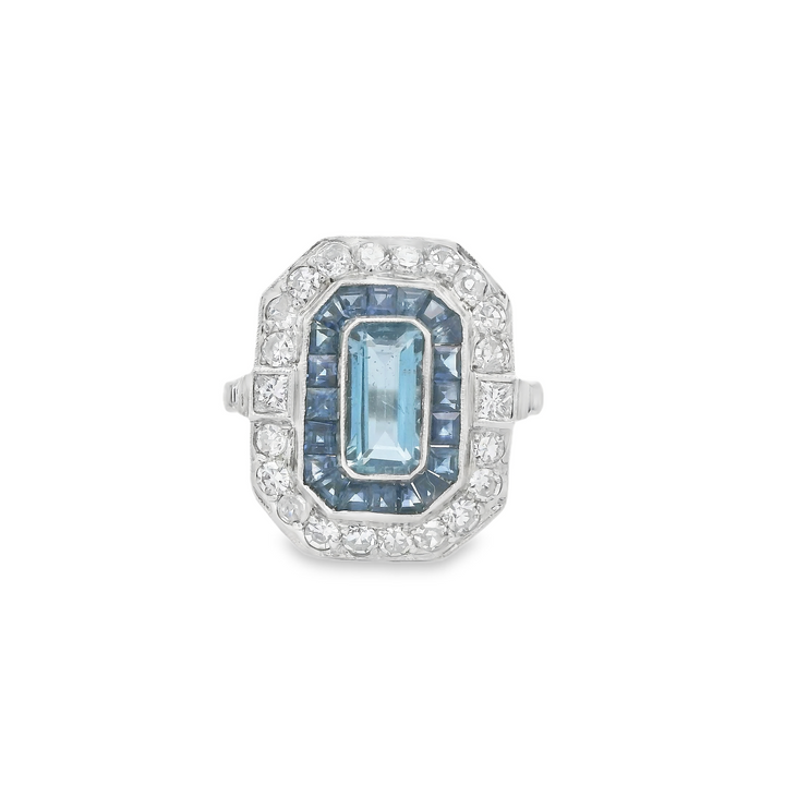 Platinum Estate Halo Gemstone Ring set with 1 Emerald Cut Aqua, 0.59 ctw, and 22 Round G/H, SI Diamonds, 0.70 ctw., and 28 French cut Sapphires, 0.84 ctw.,  total stone weight measures 2.13 ctw.