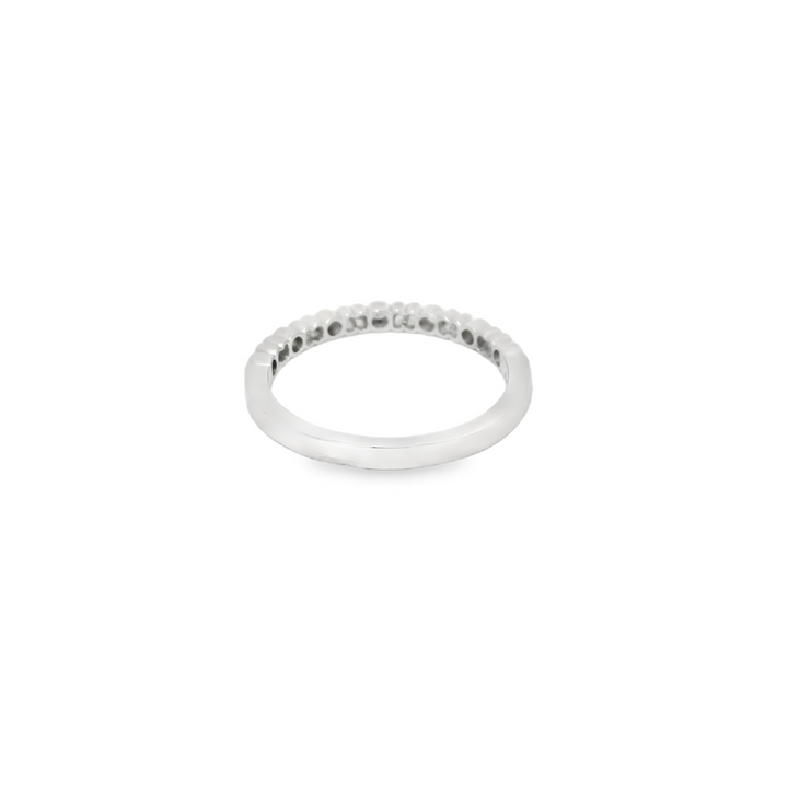 14K White Gold Bezel Set Anniversary Band set with 7 G/H SI1 - SI2 Diamonds total stone weight measures 0.08 ctw.