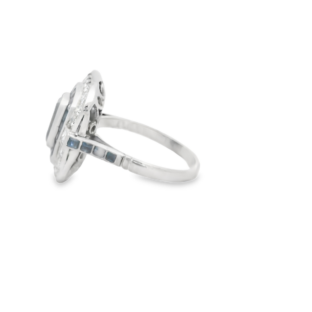 Platinum Estate Halo Gemstone Ring set with 1 Emerald Cut Aqua, 0.59 ctw, and 22 Round G/H, SI Diamonds, 0.70 ctw., and 28 French cut Sapphires, 0.84 ctw.,  total stone weight measures 2.13 ctw.