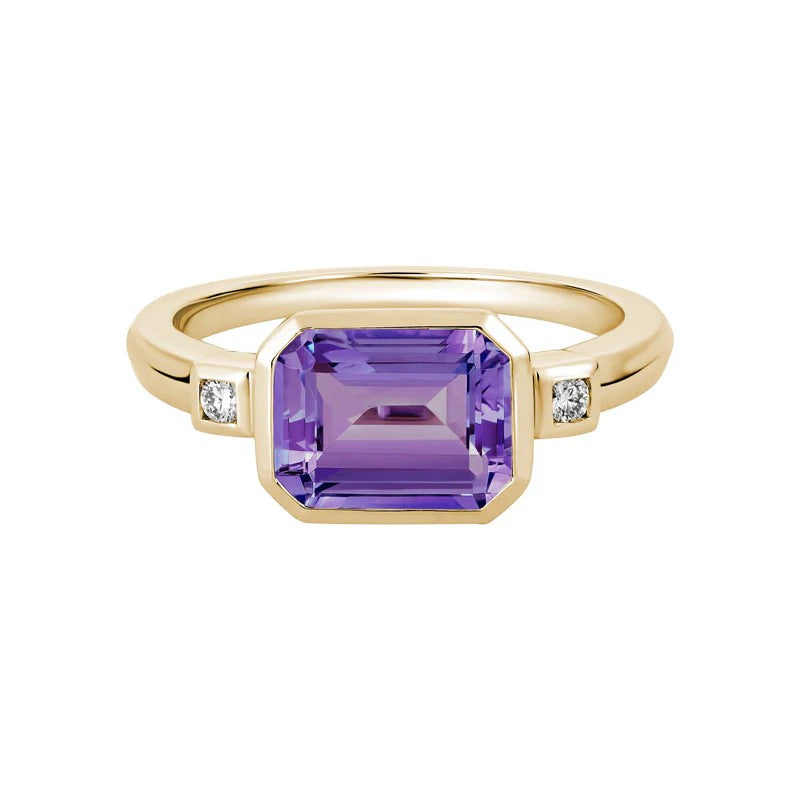 14K Yellow Gold Three Stone Bezel Set Ring set with 1 Emerald Cut Amethyst, 1.55 ct and 2 Round Diamonds, 0.05 ctw