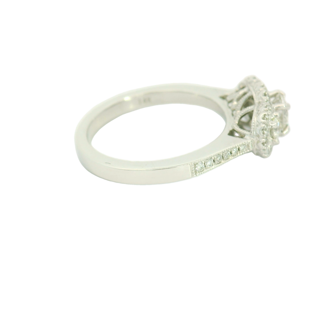 14K White Gold Three Stone Halo Engagement Ring set with 1 0.41 ct Round Diamond, G/H SI2, and 38 Round Diamonds, 0.35 ctw