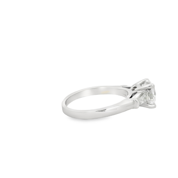 Estate Platinum Three Stone Engagement Ring set with 1 1.74 ct Round Diamond, F SI1, and 2 Baguette Diamonds, 0.46 ctw