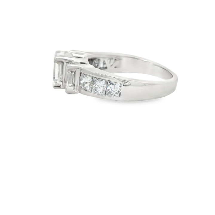 Estate 14K White Gold Three Stone Engagement Ring set with 3 1.28 ct Emerald Cut Diamonds, F/G VS1 - VS2, and 6 Princess Cut Diamonds, 0.92 ctw