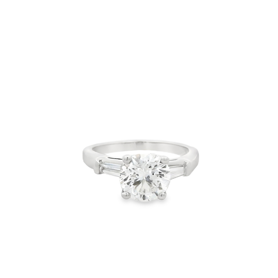 Estate Platinum Three Stone Engagement Ring set with 1 1.74 ct Round Diamond, F SI1, and 2 Baguette Diamonds, 0.46 ctw