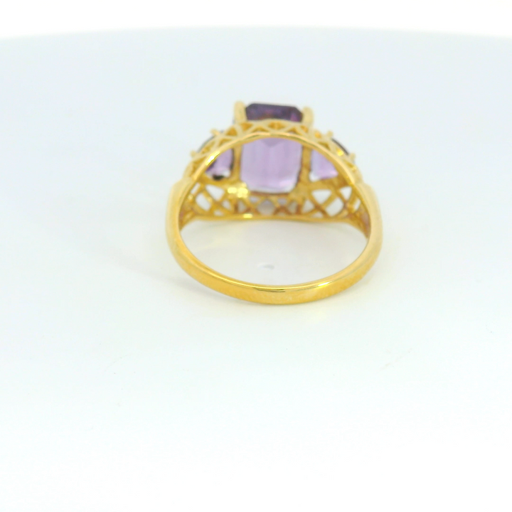 Estate 14K Yellow Gold Three Stone Ring with 1 Emerald Cut Amethyst, 3.15 ct and 2 Trillion Amethysts, 0.84 ctw