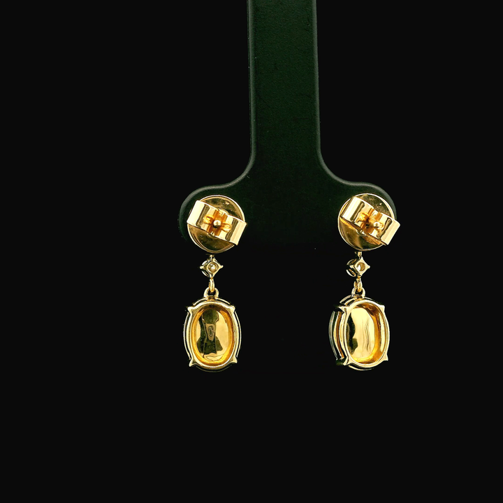 14K Yellow Gold Drop Earrings set with 2 Cabochon Moonstones, 3.53 ctw, 2 Round Diamonds, 0.06 ctw and 2 Round Aquamarines, 0.26 ctw