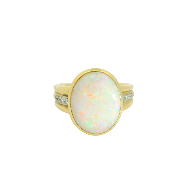 14K Yellow Gold Accented Gemstone Ring set with 1 Opal 4.40 ctw. and Diamonds 0.09 ctw.,   total stone weight measures 4.49 ctw.