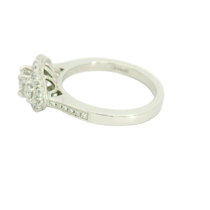 14KG White Gold Halo, Three stone Engagement Ring Total diamond weight for ring measures 0.76 ctw.