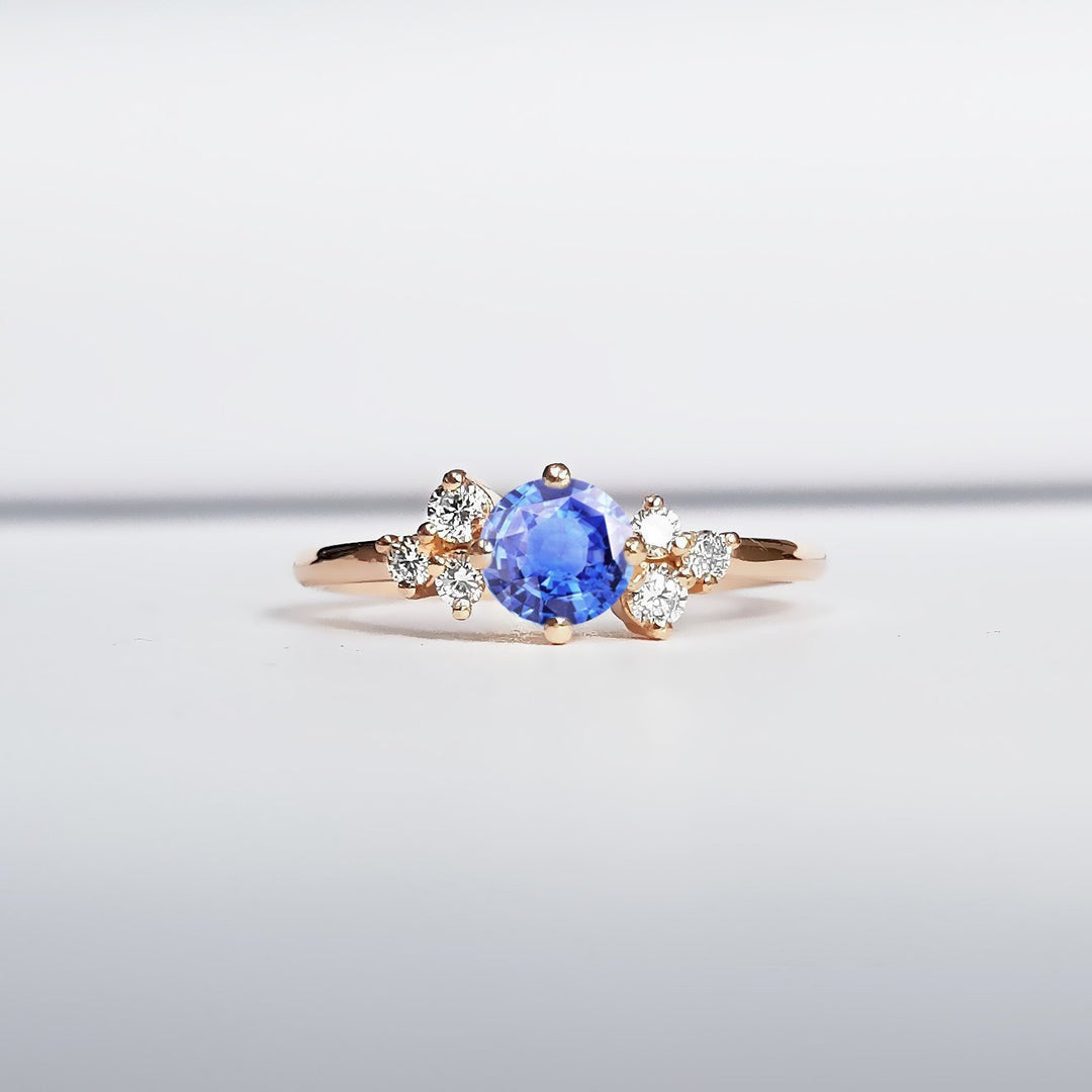 Light blue sapphire and diamond unique engagement